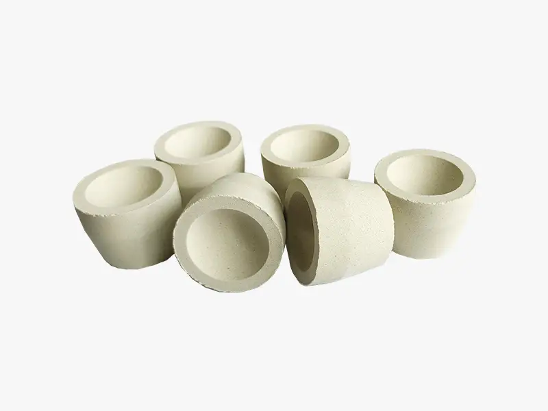 DECENT Magnesia Cupels for gold assay, showcasing six cupels.