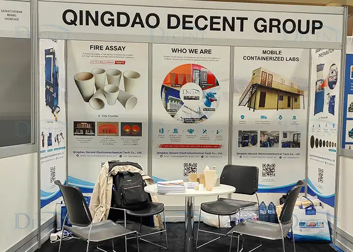 Qingdao Decent Group exhibition booth at PDAC 2024, showcasing fire assay equipment and mobile containerized labs.