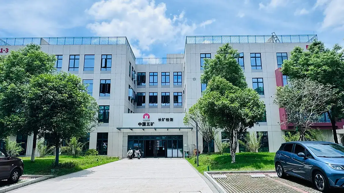 Revolutionizing Fire Assay: How China’s Premier Mining Lab Achieved 40% Efficiency Gains with Decent Group Semi-Automatic System插图 This is where DECENT assists with upgrading the Fire Assay Lab. Exterior view of a modern building, identified as a Mineral Test Laboratory of China Minmetals Corporation, surrounded by greenery and a parking area.
