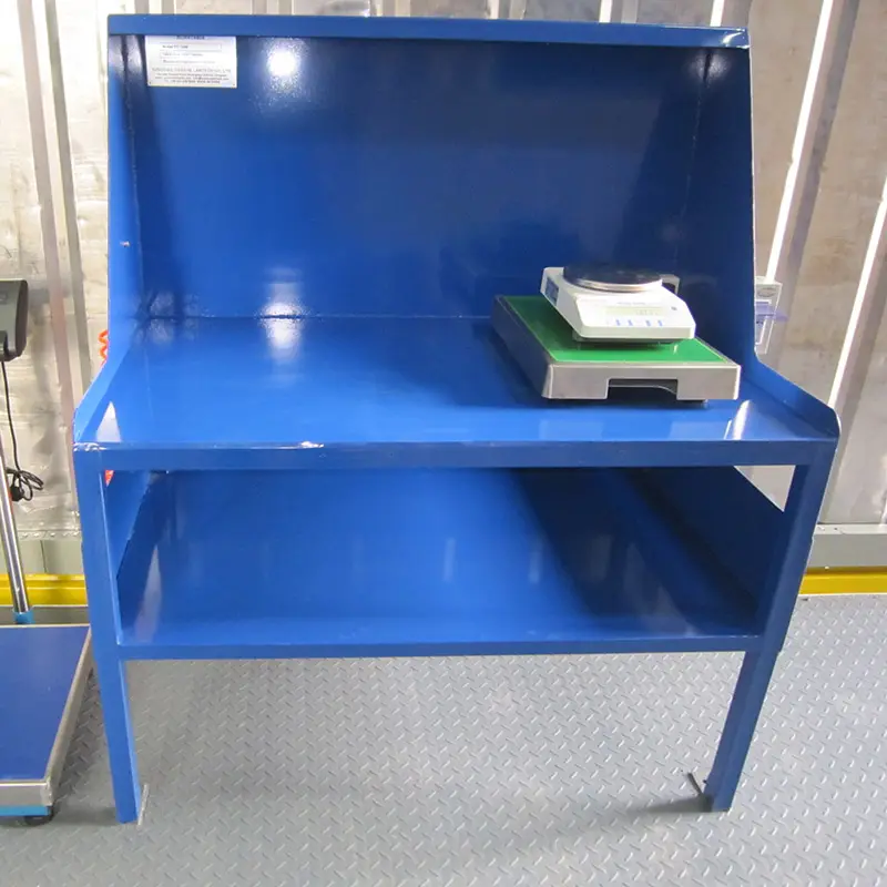 Revolutionary Container laboratory of sample preparation: 2015 South Korea Project 4 DECENT Group blue weighing station with scale, showing sturdy metal construction and lower storage shelf for laboratory or industrial use.