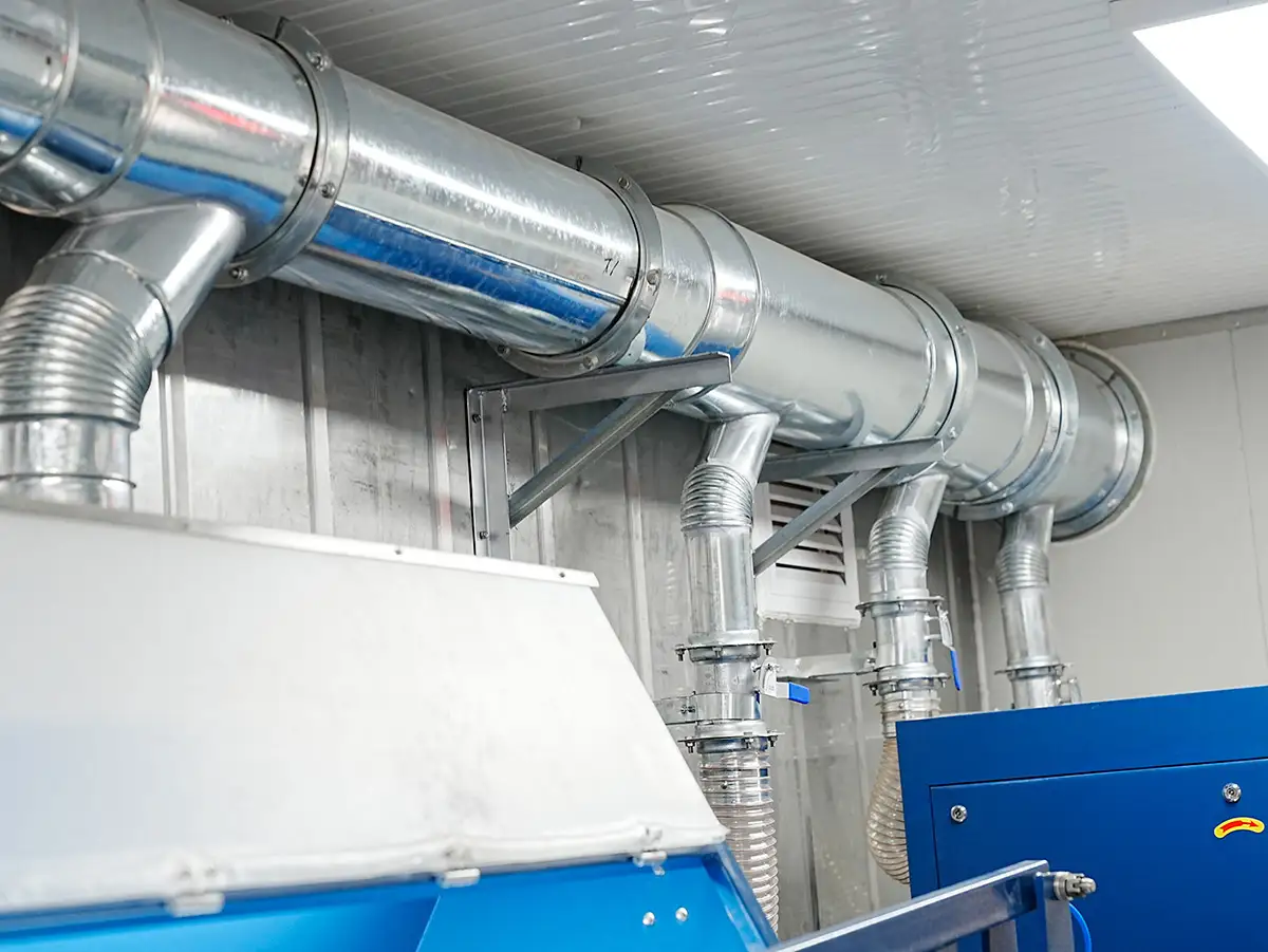 2025 Container Laboratory Triumph: DECENT Mexican Project Sets New Global Benchmark 5 Galvanized steel ventilation ducts connecting blue sample preparation equipment inside a DECENT container laboratory.