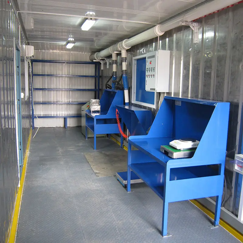 Revolutionary Container laboratory of sample preparation: 2015 South Korea Project 2 Interior of a DECENT container laboratory of sample preparation showing two blue workstations, wall shelving, and industrial lighting for mobile testing or analysis.