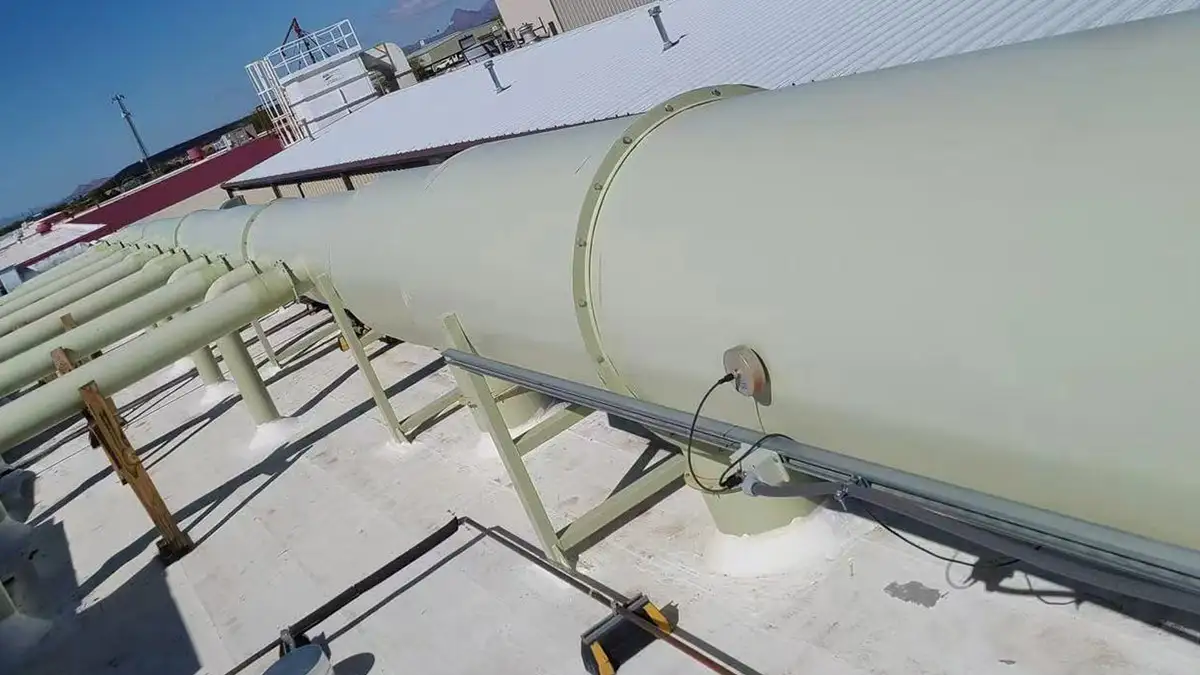 Revolutionary Dust Removal System Project in 2019:Enhancing Lab Safety in North America 1 Dust removal system project by Qingdao Decent Group on a rooftop, with large pipes and supporting structures