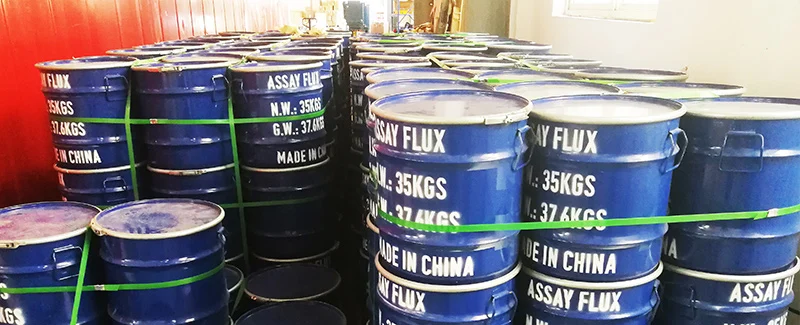 DECENT Fire Assay Flux: Blue barrels of assay flux in storage