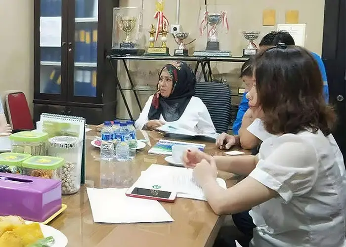 Strategic Cooperation Breakthrough: Qingdao Decent Group Achieves Landmark Global Victory in 2018 4 Close-up of a meeting table with Qingdao Decent Group and PT. ANTAM Tbk representatives discussing strategic cooperation