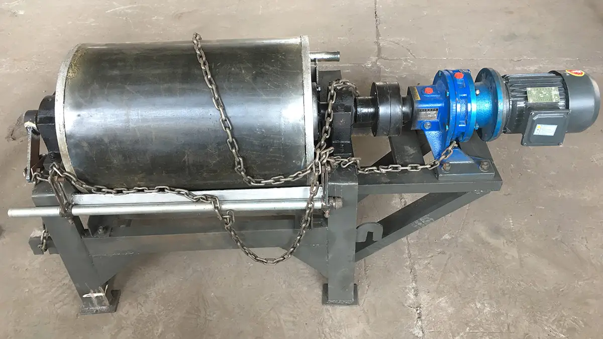 Industrial magnetic drum with motor and chains on a grey frame, by Qingdao Decent Group