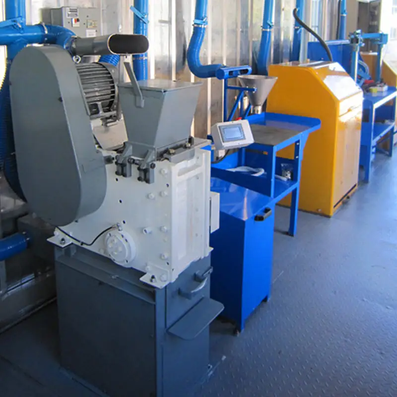 Containerized Laboratory: 2013 Breakthrough Project for Mobile Mineral Sample Preparation 3 Inside a containerized laboratory, showing a grey jaw crusher and other blue mineral sample preparation machines connected by overhead ventilation ducts.