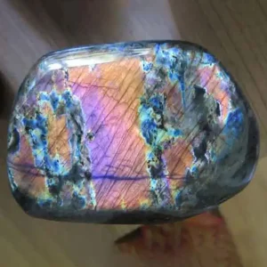 5 Stunning The Minerals Types That Will Amaze You - Nature's Hidden Treasures 12 A polished piece of Ealing Stone, also known as labradorite, with a stunning iridescent play of colors including blue, purple, and orange.