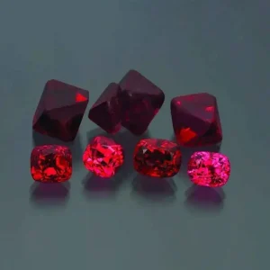 5 Stunning The Minerals Types That Will Amaze You - Nature's Hidden Treasures 21 A group of brilliant red spinel gemstones, both rough crystals and polished faceted stones, a magnesium aluminum oxide mineral.