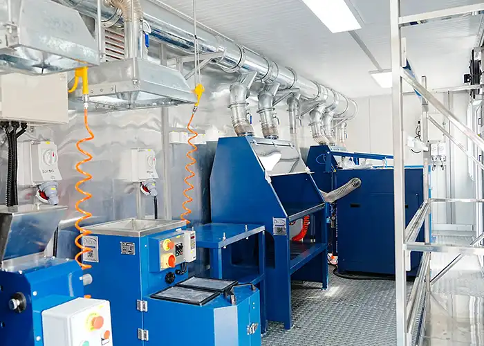 Internal view of Qingdao Decent Group's 40HQ containerized lab, featuring blue sample processing equipment, ventilation ducts, and a clean, organized layout for efficient operations in Côte d’Ivoire.