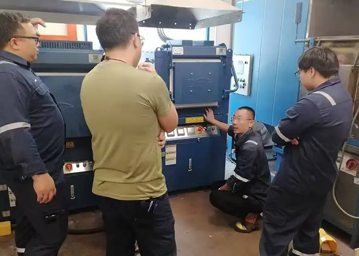 This image captures a crucial moment of Qingdao Decent Group's commitment to excellence, showing their team on-site in Singapore overseeing the installation and providing hands-on training for advanced DECENT Fire Assay Laboratory Equipment. The scene highlights the intricate process of upgrading laboratory capabilities, ensuring precise and efficient mineral analysis. This dedication to comprehensive support underscores Qingdao Decent Group's triumph in delivering cutting-edge solutions and fostering expertise in fire assay technology.