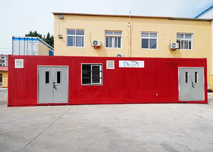 A large red remote mining lab from DECENT, featuring two gray doors and a window, designed for sample preparation.