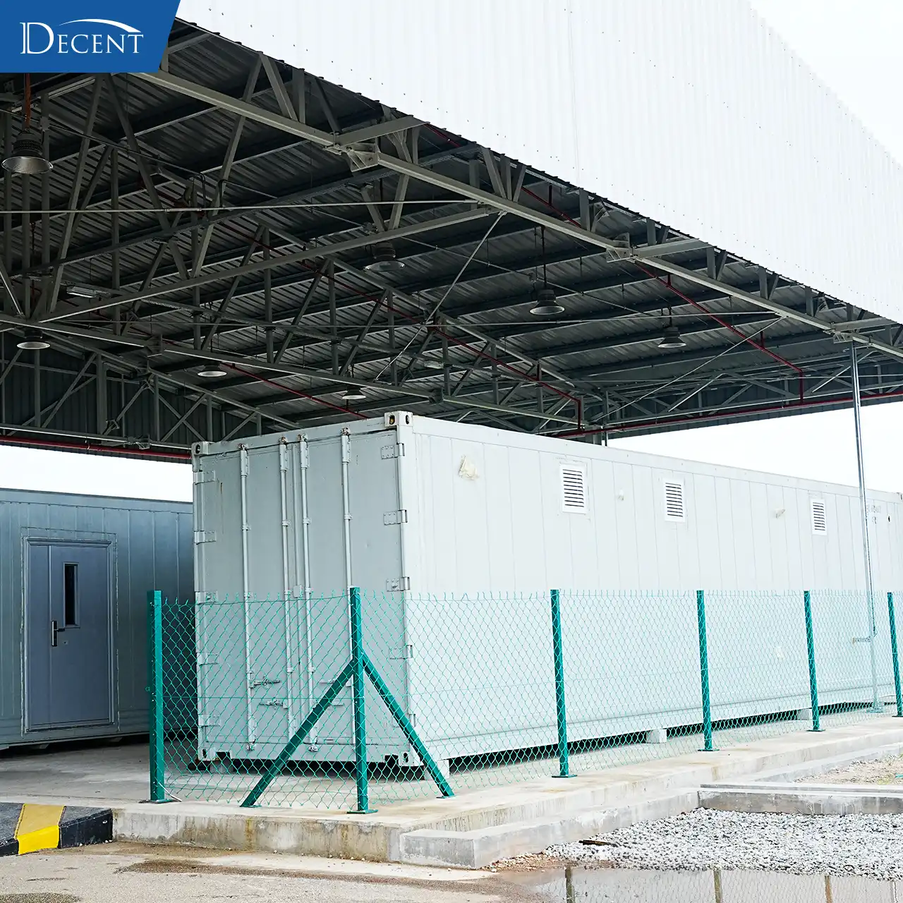 Exterior of DECENT prefabricated modular mineral lab units by Qingdao Decent Group, secured with fencing