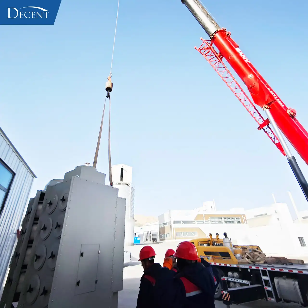 Qingdao Decent Group's professional installation team hoisting industrial dust collection system for the high-standard fire assay laboratory built for Qinghai mining area at high-altitude fire assay lab construction.
