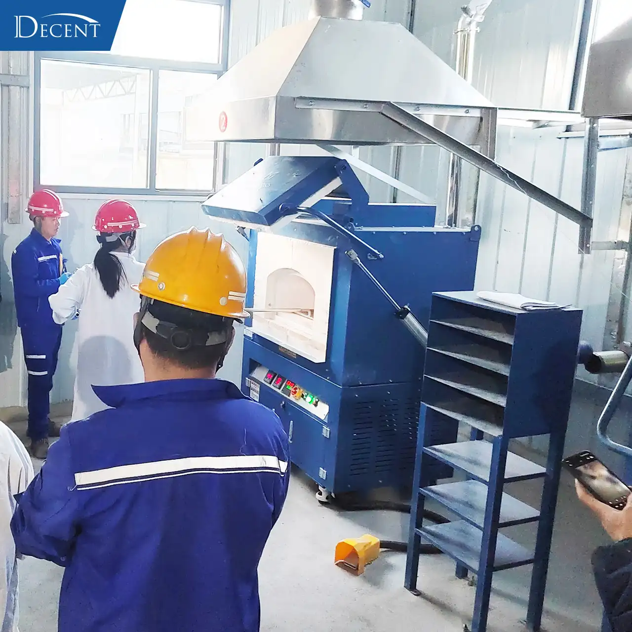 Qingdao Decent Group engineers conducting on-site product training and practical operation demonstration of fire assay furnace for Qinghai mining lab staff in extreme cold prefabricated house.