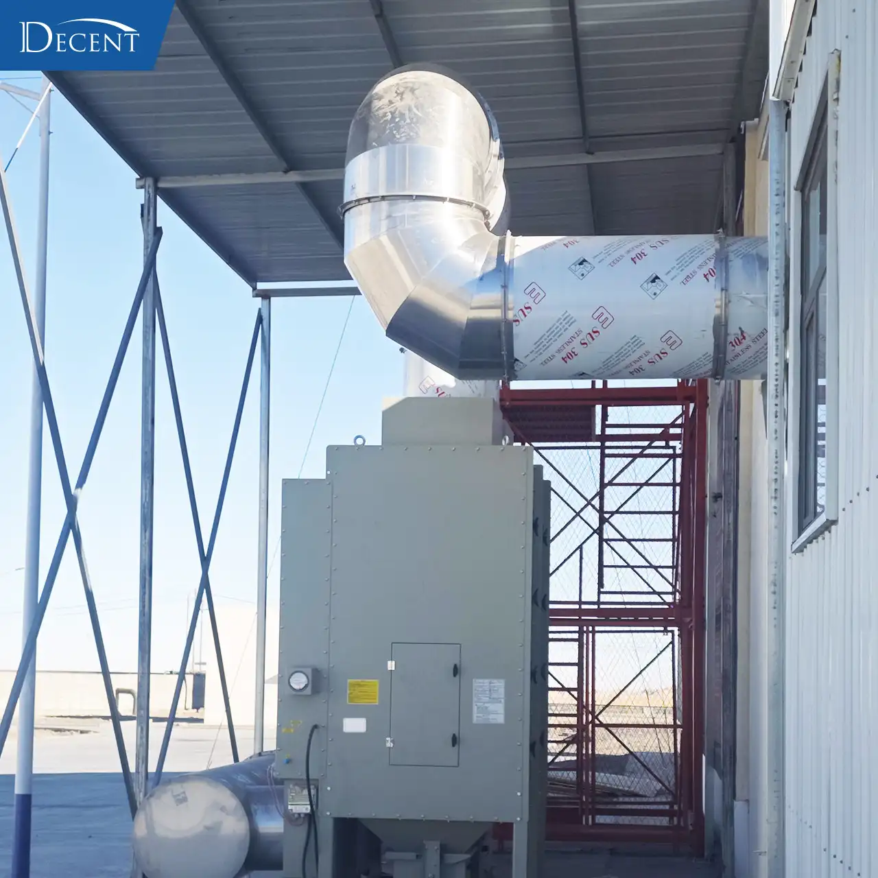 External stainless steel dust collection system for Qinghai mining fire assay lab, installed by Qingdao Decent Group in extreme cold prefabricated house conditions.