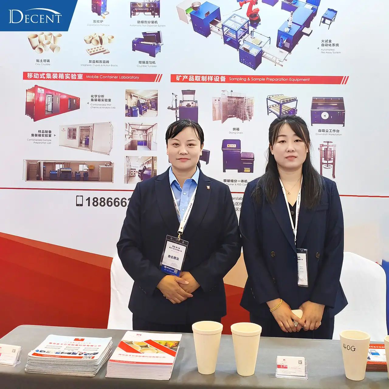 Qingdao Decent Group booth at 2026 Gold Tech Conference, sales representatives showcasing fire assay automation and sample prep equipment for gold mining labs